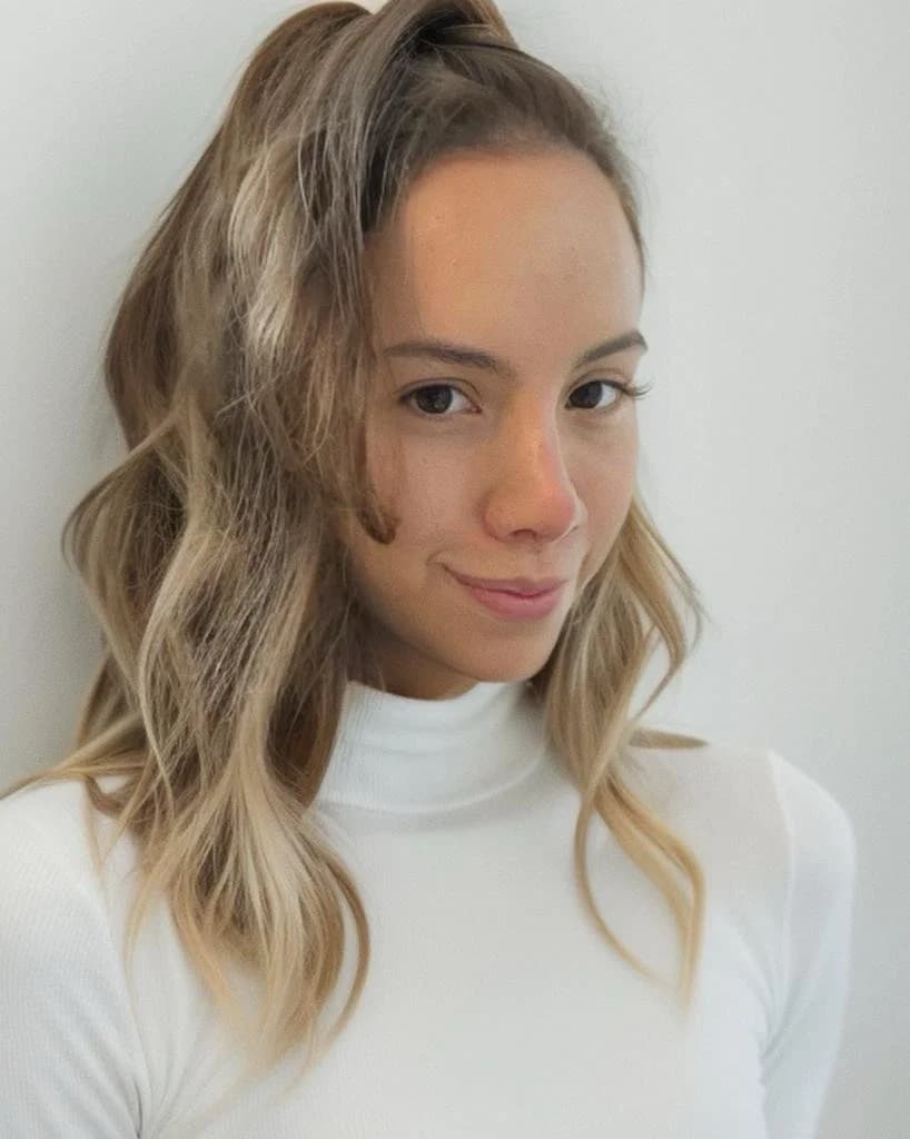 Portrait of Alejandra Loudiyi Salerno in a white turtleneck